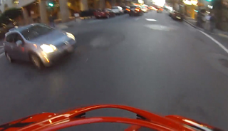 Illustration for article titled Watch This Helmet Cam Accident of a Car Blowing a Red Light in the City